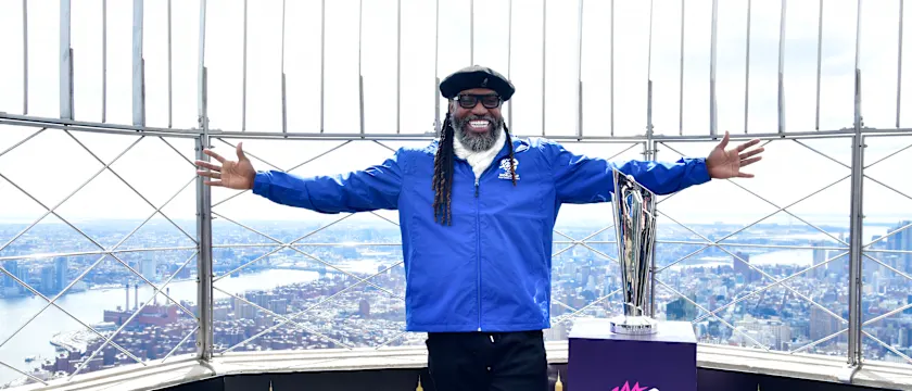 Chris Gayle at the top of the Empire State Building with the MT20WC Trophy