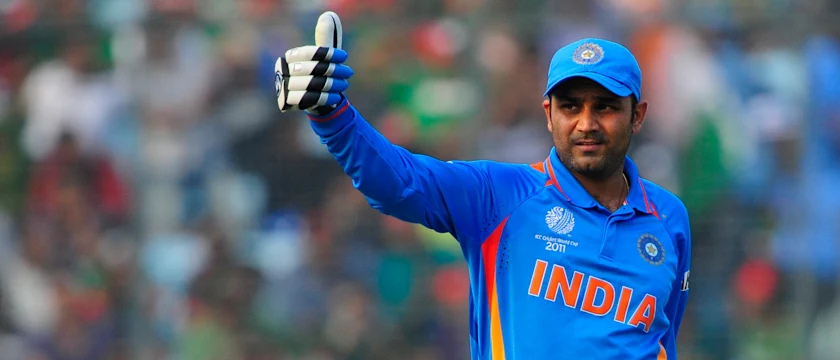Virender Sehwag celebrates his century against Bangladesh.