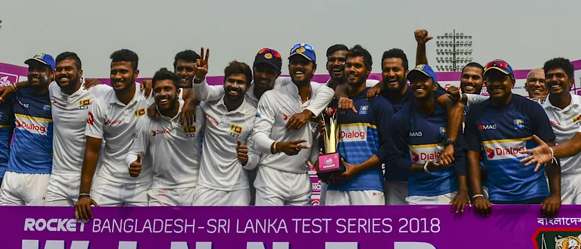 The Sri Lankans pose with their spoils after winning the two-Test series in Bangladesh.