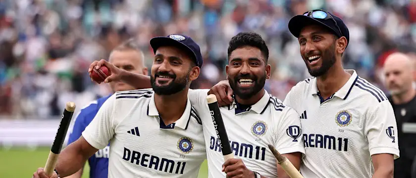 India's Akash Deep, Prasidh Krishna hold the stumps and Mohammed Siraj holds the match ball after taking 5 wickets after winning the final Test cricket match between England and India at The Oval