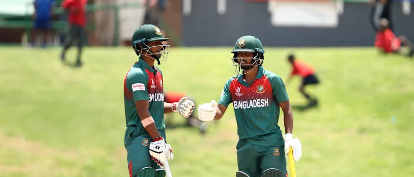 Mohammad Tawhid Hridoy of Bangladesh and Shahadat Hossain of Bangladesh celebrate a half century partnership.