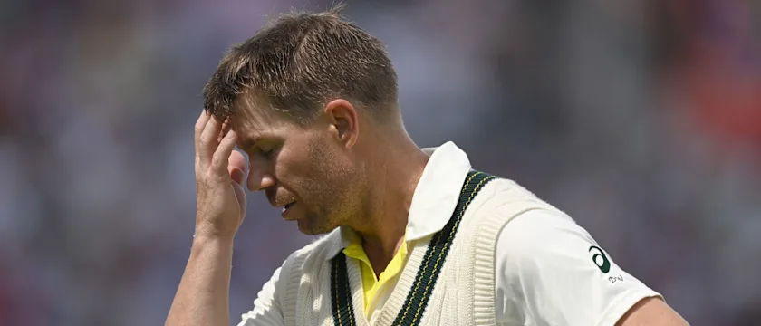 Warner-head-in-hands