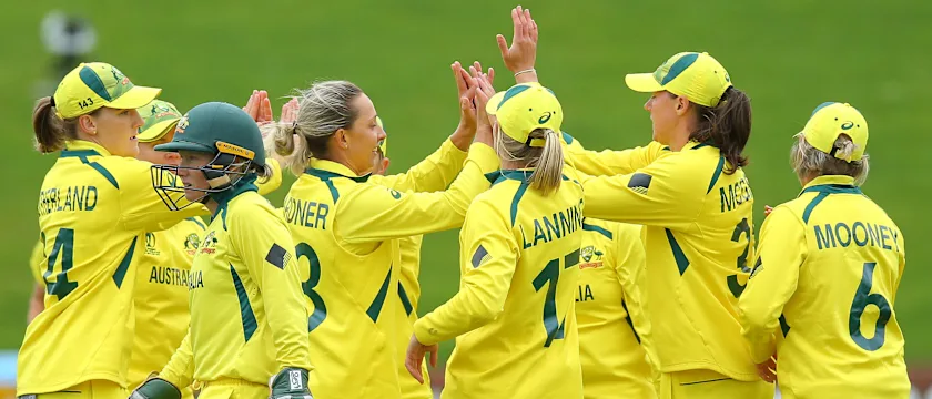 Ashleigh Gardner (3L) of Australia celebrates with teammates