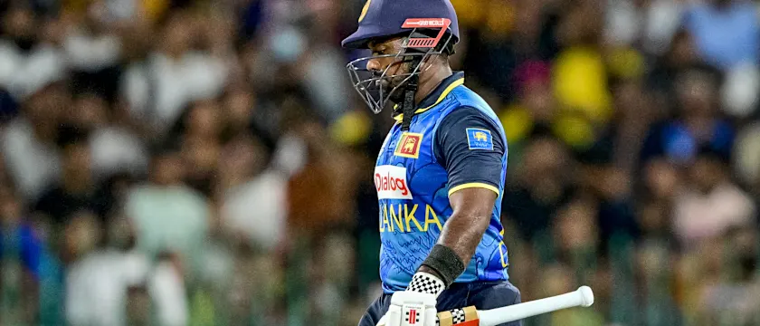 Sri Lanka's captain Charith Asalanka walks back to the pavilion after his dismissal