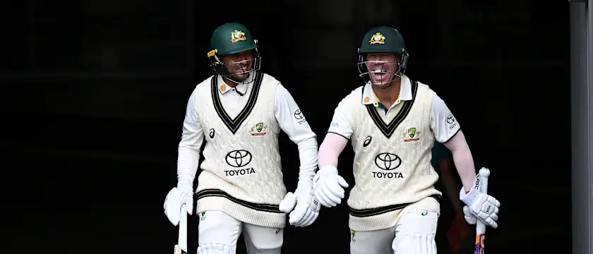 Usman Khawaja and David Warner of Australia share a laugh as they take to the field during day three of the Second Test Match between Australia and Pakistan