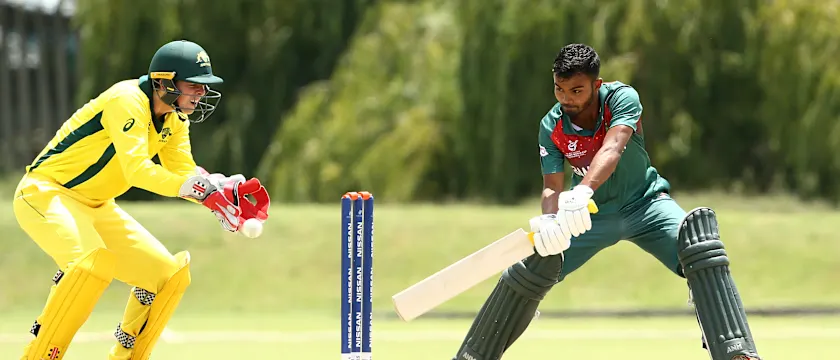 Tawhid Hridoy of Bangladesh bats with Patrick Rowe of Australia looking on during the ICC U19 Cricket World Cup warm up match between Bangladesh and Australia at Tuks Cricket Oval on January 13, 2020 in Pretoria, South Africa.
