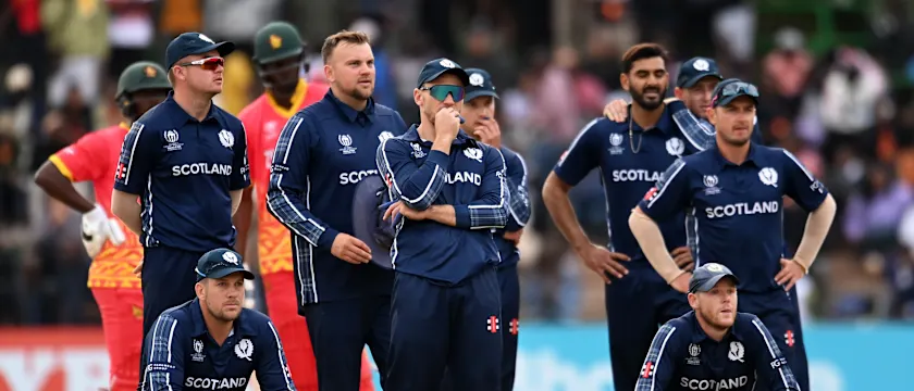 Players of Scotland watch the big screen during a review during the ICC Men's Cricket World Cup Qualifier Zimbabwe 2023 match between Zimbabwe and Scotland at Queen’s Sports Club on July 04, 2023 in Bulawayo, Zimbabwe.