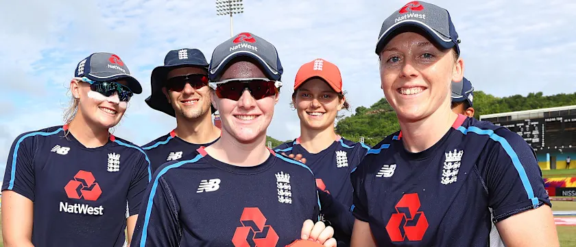 Heather Knight of England presents Kirstie Gordon of England with her first cap during the ICC Women's World T20 2018 match between England and Bangladesh at Darren Sammy Cricket Ground on November 12, 2018 in Gros Islet, Saint Lucia.