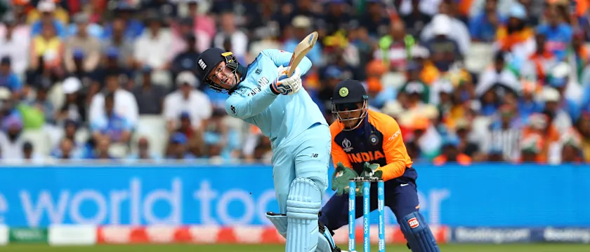 Jason Roy of England hits straight off the bowling of Kuldeep Yadav as India wicketkeeper MS Dhoni looks on during the Group Stage match of the ICC Cricket World Cup 2019 between England and India at Edgbaston on June 30, 2019 in Birmingham, England.