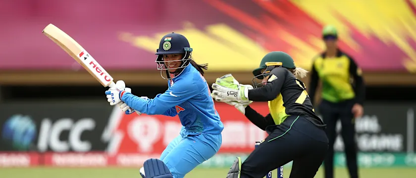 Smriti Mandhana of India bats with Alyssa Healy of Australia looking on during the ICC Women's World T20 2018 match between India and Australia at Guyana National Stadium on November 17, 2018 in Providence, Guyana.