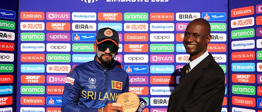 Dimuth Karunarathana of Sri Lanka poses for a photo with the Player of the Match award.