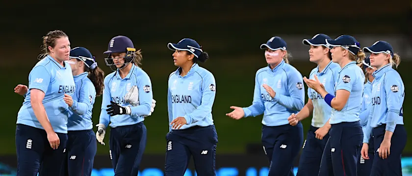 Anya Shrubsole (L) of England celebrates with teammates after dismissing Marizanne Kapp of South Africa during the 2022 ICC Women's Cricket World Cup match between South Africa and England at Bay Oval on March 14, 2022 in Tauranga, New Zealand.