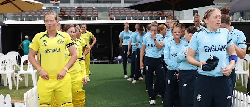Meg Lanning of Australia and Heather Knight of England prepare to lead their sides out to the field of play for the 2022 ICC Women's Cricket World Cup match between Australia and England at Seddon Park on March 05, 2022 in Hamilton, New Zealand.