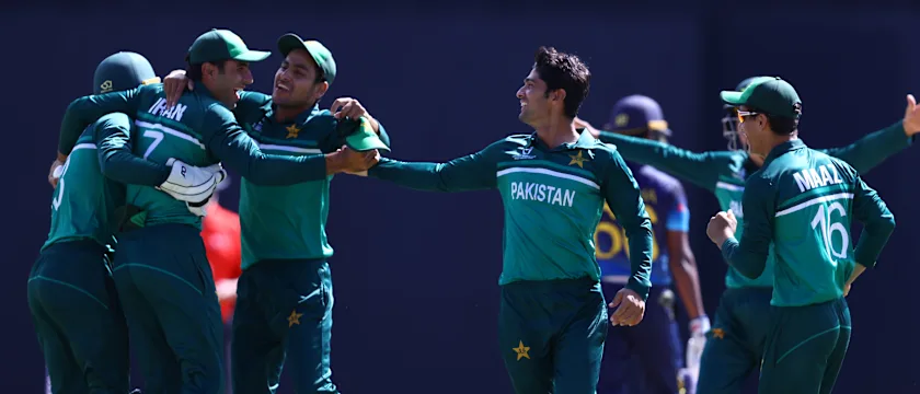 Qasim Akram of Pakistan celebrates the wicket of Sadisha Rajapaksa of Sri Lanka for their fifth wicket with team mates during the 5th/6th Playoff match between Sri Lanka and Pakistan at Sir Vivian Richards Stadium on February 03, 2022 in Antigua.