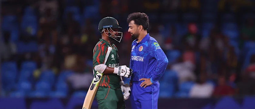 Litton Das of Bangladesh and Rashid Khan of Afghanistan interact between wickets during the ICC Men's T20 Cricket World Cup