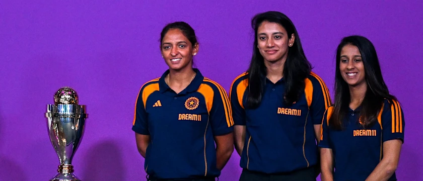 Jemimah Rodrigues, Smriti Mandhana and Harmanpreet Kaur pose with the Women's World Cup trophy