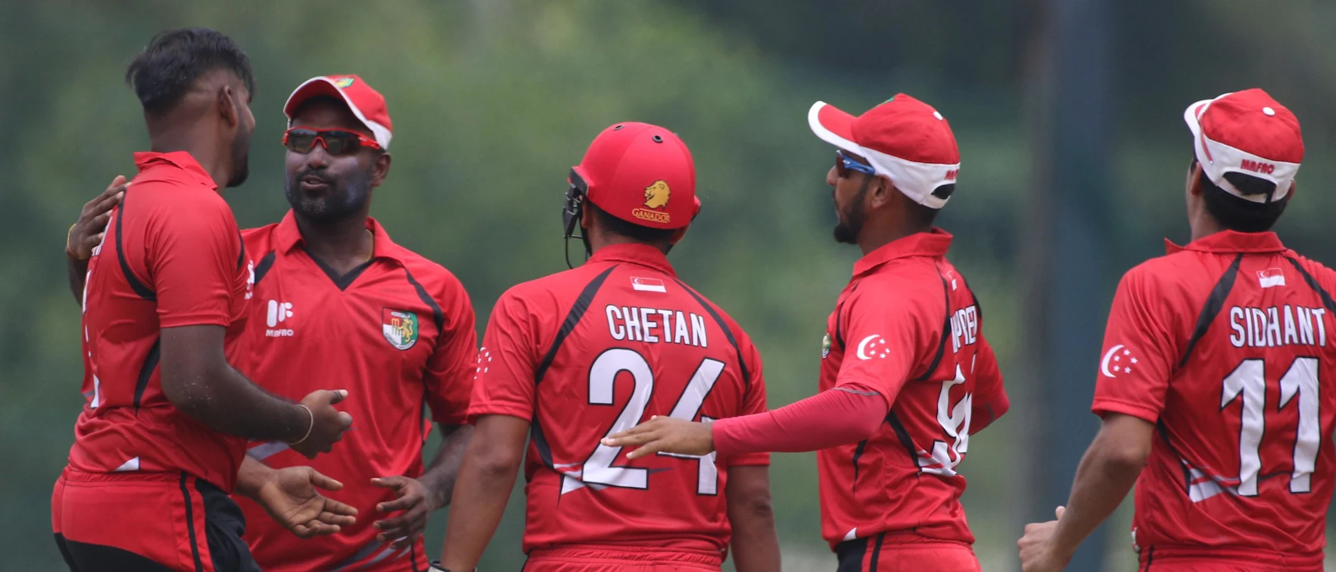 Logo of Singapore players celebrate