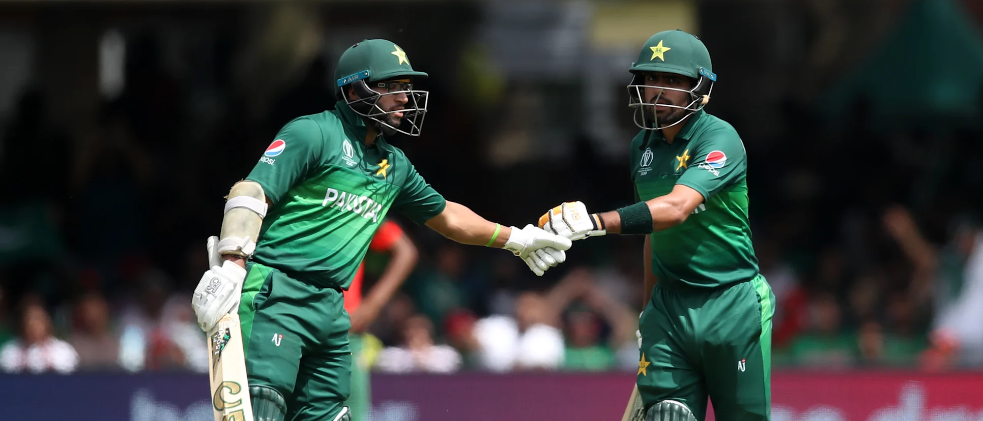 Logo of Imam Ul-Haq and Babar Azam of Pakistan embrace during the Group Stage match of the ICC Cricket World Cup 2019 between Pakistan and Bangladesh at Lords on July 05, 2019 in London, England.