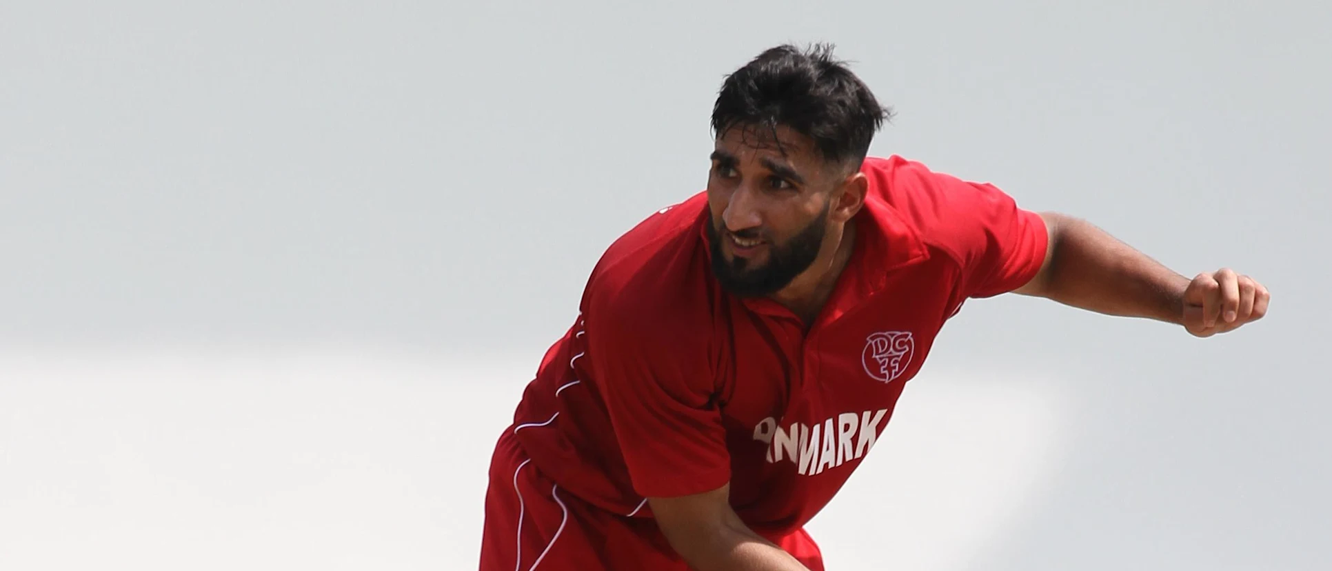 Logo of Denmark's Hamid Mazhar Shah in action during his team's WCL Division 4 encounter against Jersey