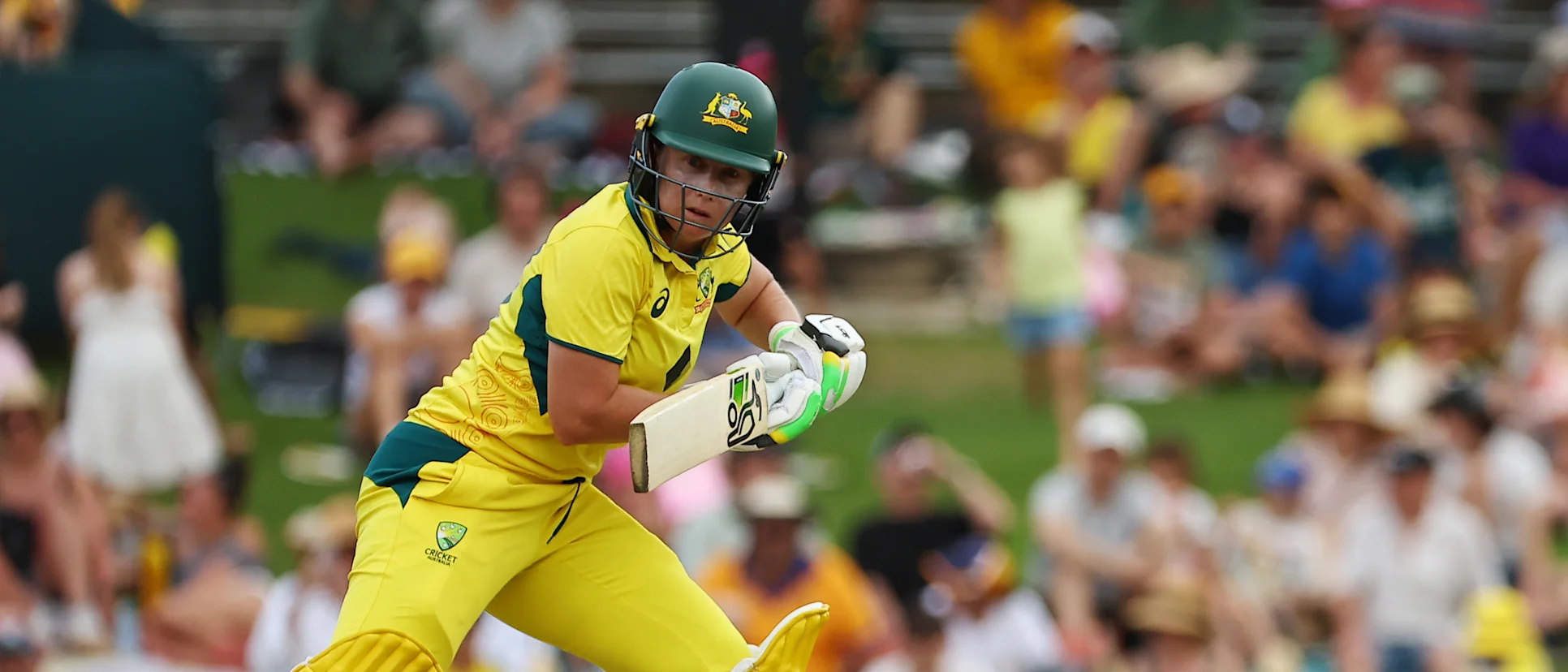 Logo of Alyssa Healy bats against England
