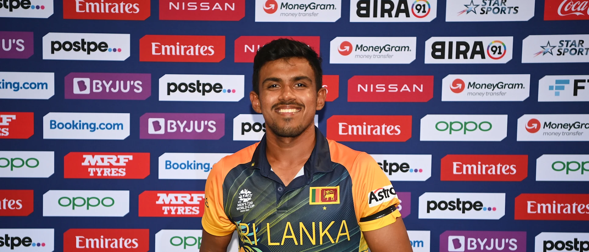 Logo of Maheesh Theekshana of Sri Lanka poses after being of named Player of the Match following the ICC Men's T20 World Cup match between Sri Lanka and Namibia at Sheikh Zayed stadium on October 18, 2021 in Abu Dhabi, United Arab Emirates.