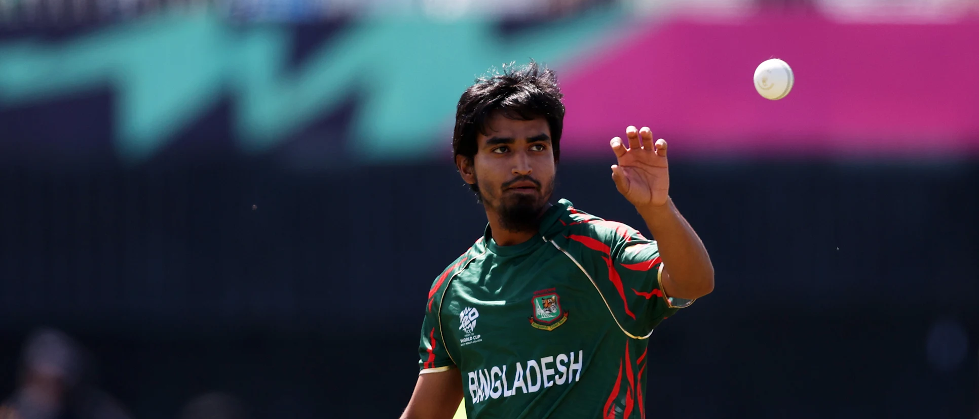 Logo of Tanzim Hasan Sakib of Bangladesh gathers the ball during the ICC Men's T20 Cricket World Cup West Indies & USA 2024 match between South Africa and Bangladesh at Nassau County International Cricket Stadium on June 10, 2024 in New York, New York.