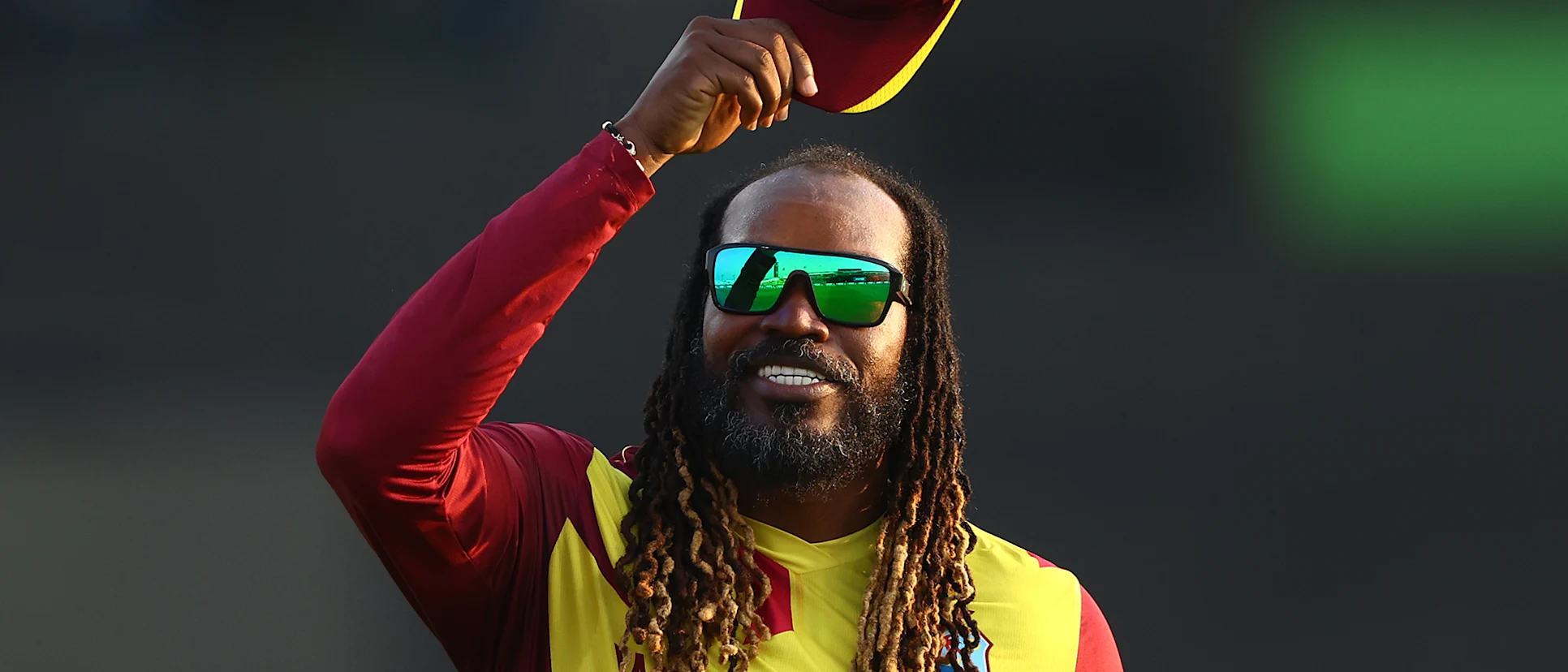 Logo of Gayle tips his hat