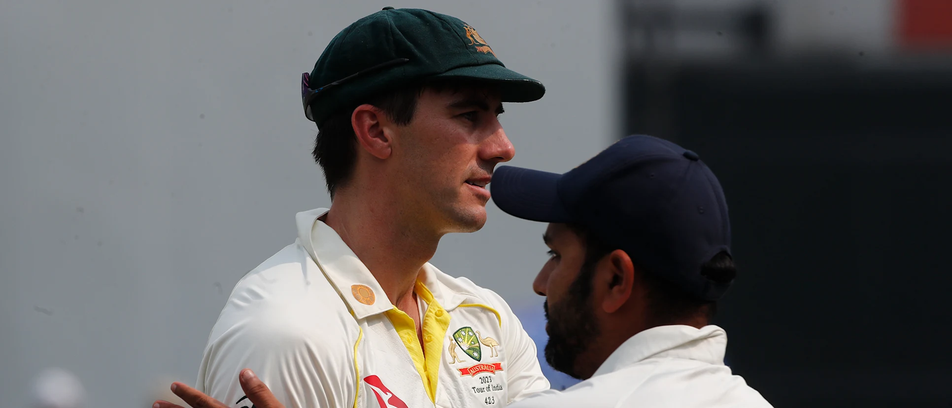 Logo of Pat Cummins of Australia interacts with the Rohit Sharma of India after the match during day three of the Second Test match in the series between India and Australia 1920x1080