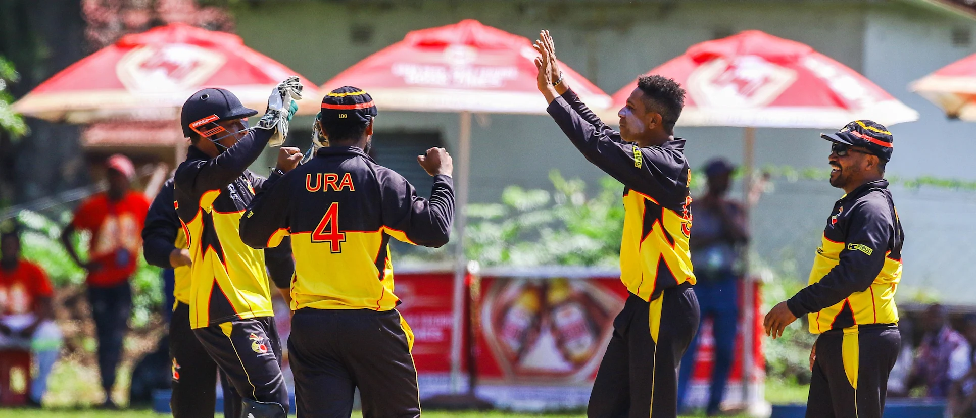 Logo of PNG bowler CJ Charles Amini celebratesa a wicket with his team mates during a play off match between Hong Kong and Papua New Guinea in the World Cup Quailfiers played at Old Hararians, March 17 2017 (©ICC).