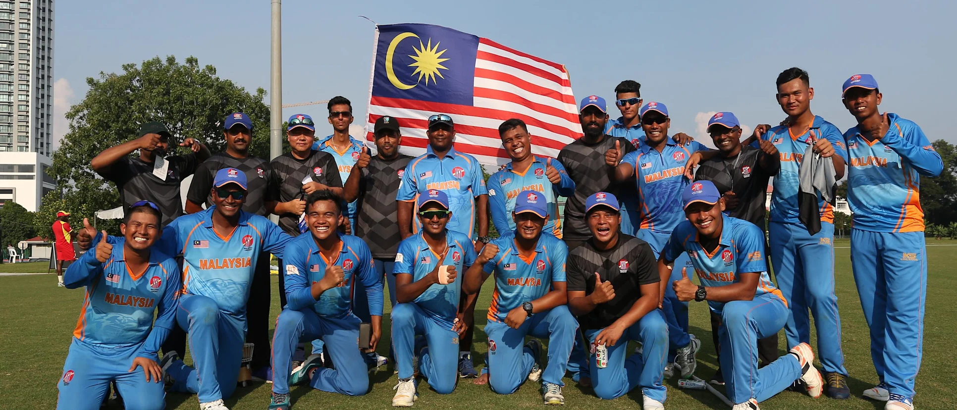 Logo of Malaysia team celebrates after winning their opening encounter against Uganda