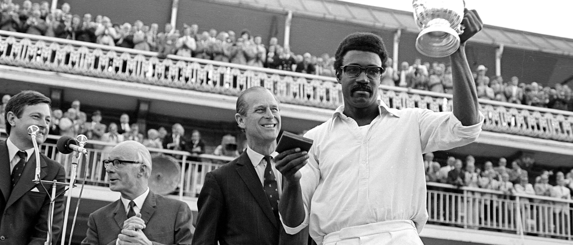 West Indies captain Clive Lloyd poses with the inaugural ICC Men's Cricket World Cup trophy