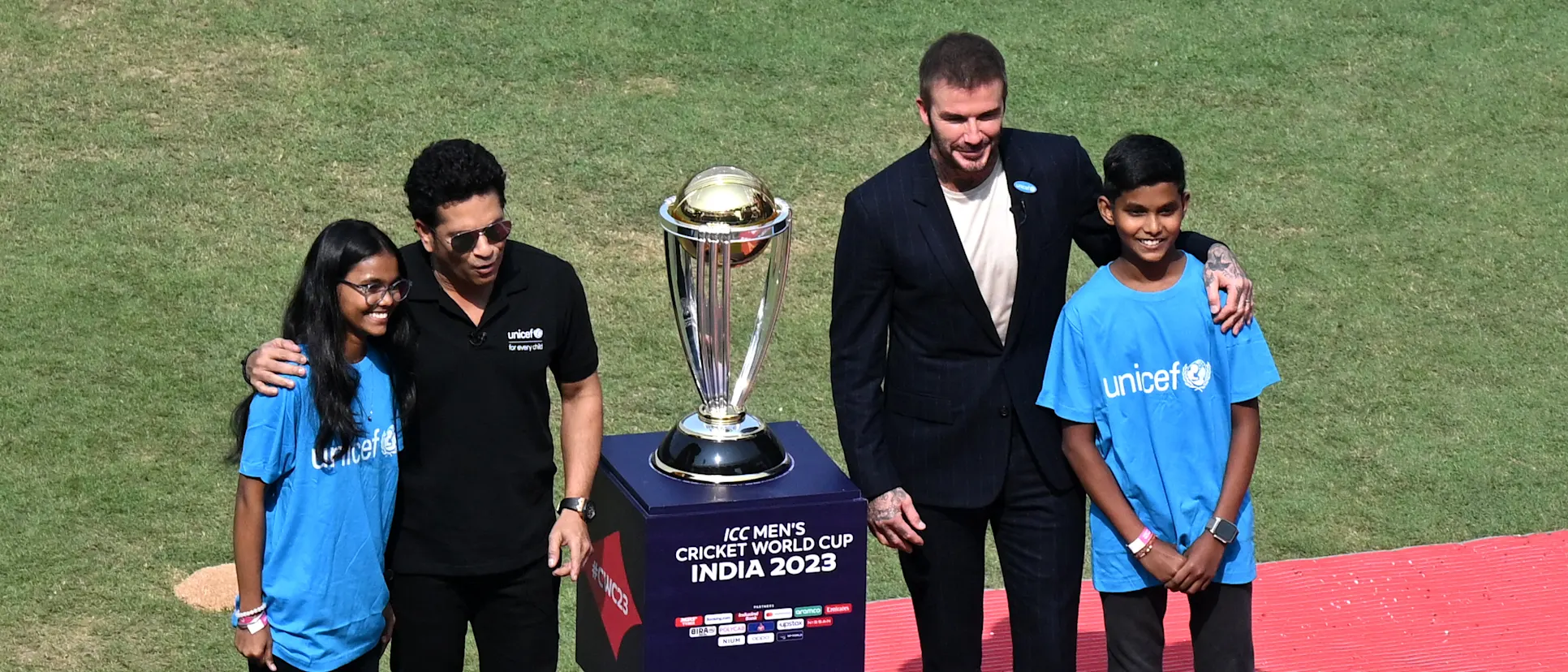 Logo of David Beckham and Sachin Tendulkar with CWC23 trophy
