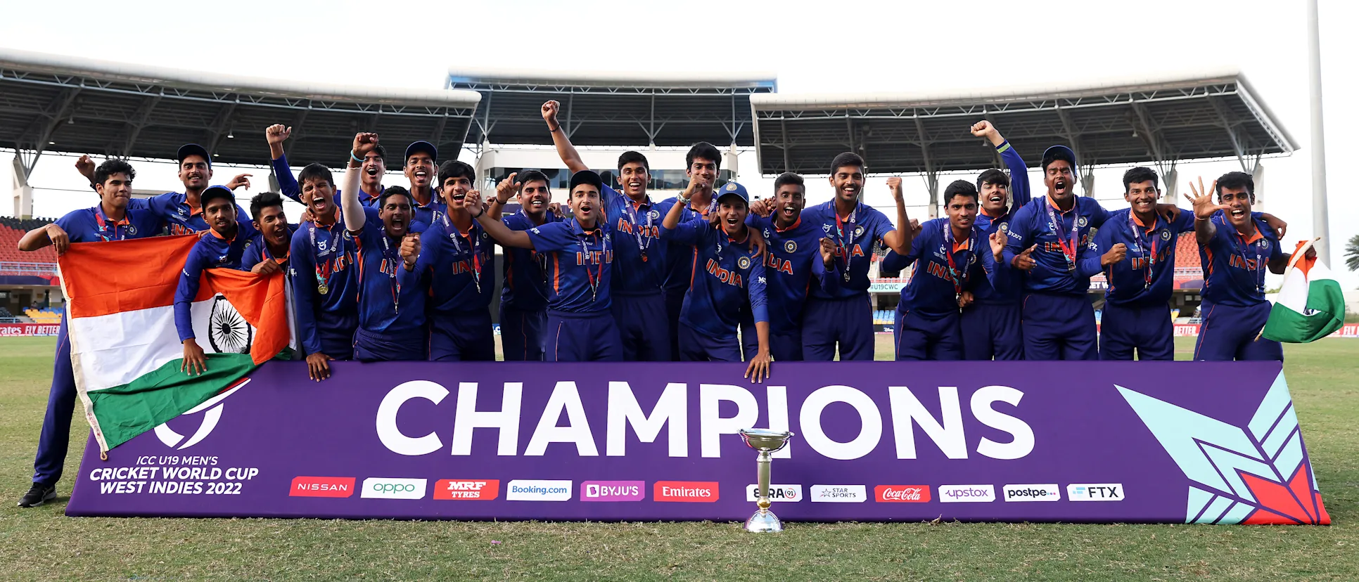Logo of Players of India pose with the ICC U19 Men's World Cup Trophy following the ICC U19 Men's Cricket World Cup Final match between England and India at Sir Vivian Richards Stadium on February 05, 2022 in Antigua, Antigua and Barbuda.
