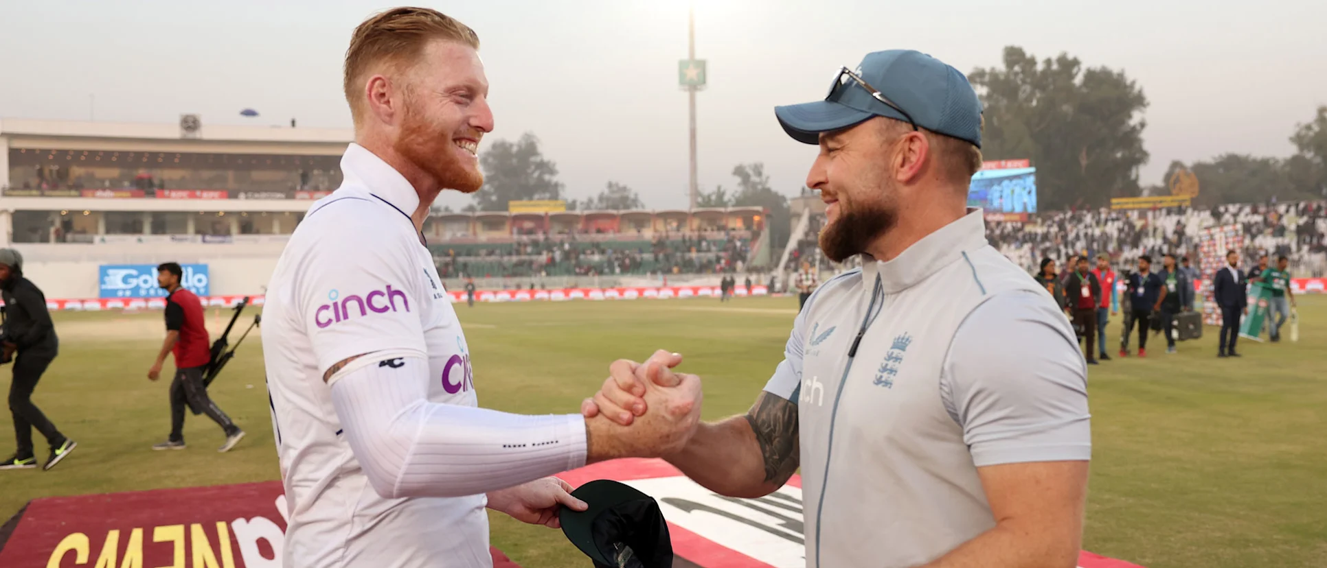 Logo of Ben Stokes and Brendon McCullum embrace after the win