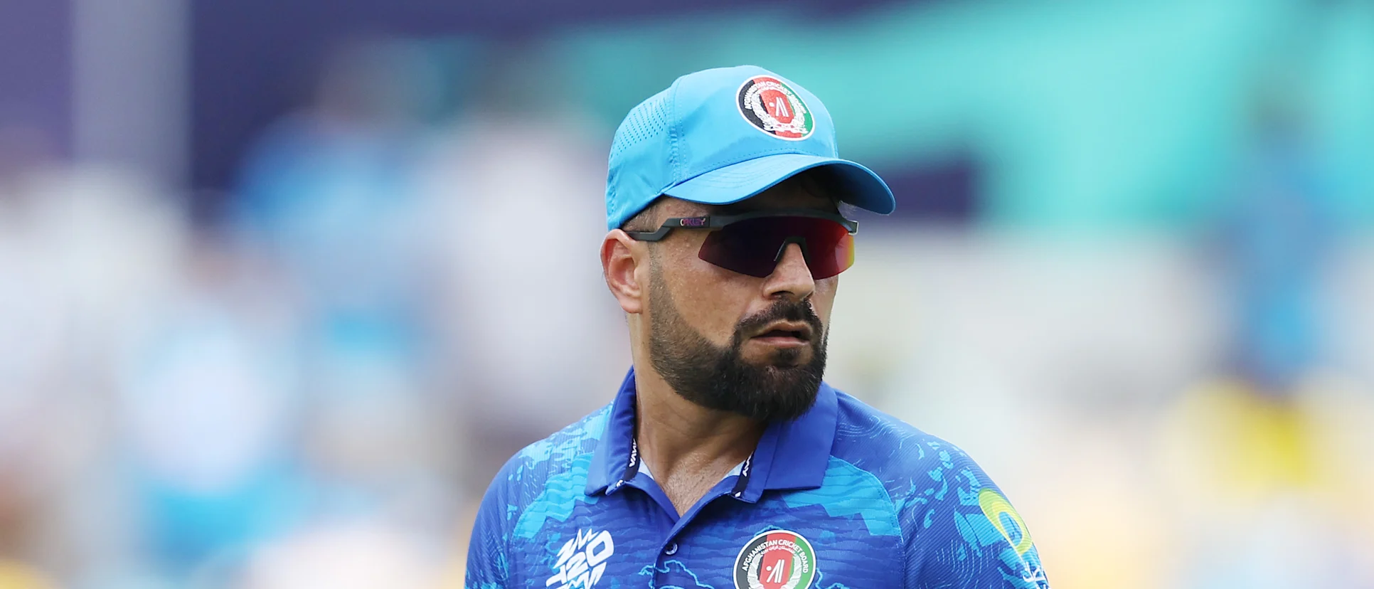 Logo of Rashid Khan of Afghanistan looks on during the ICC Men's T20 Cricket World Cup West Indies & USA 2024 Super Eight match between Afghanistan and India at Kensington Oval on June 20, 2024 in Bridgetown, Barbados.