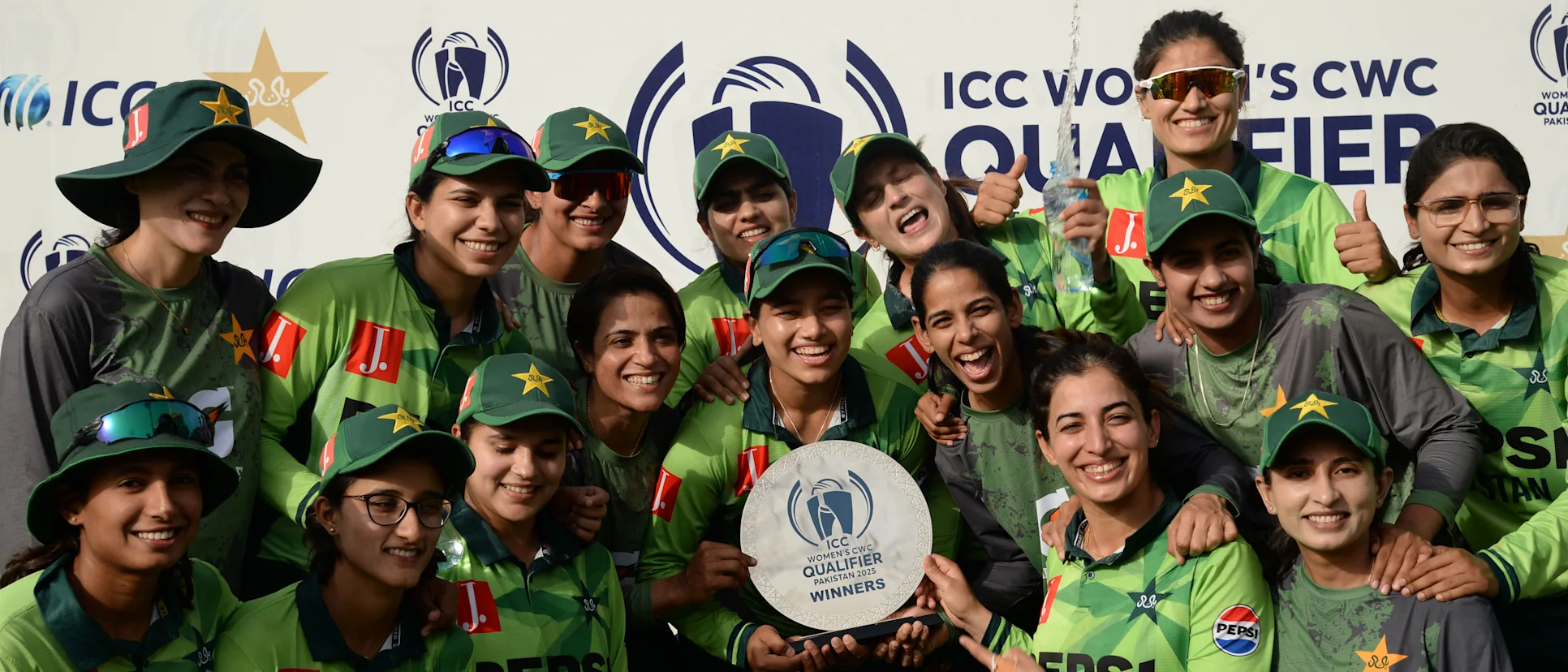 Logo of Pakistan team pose with ICC Women's World Cup Qualifier shield