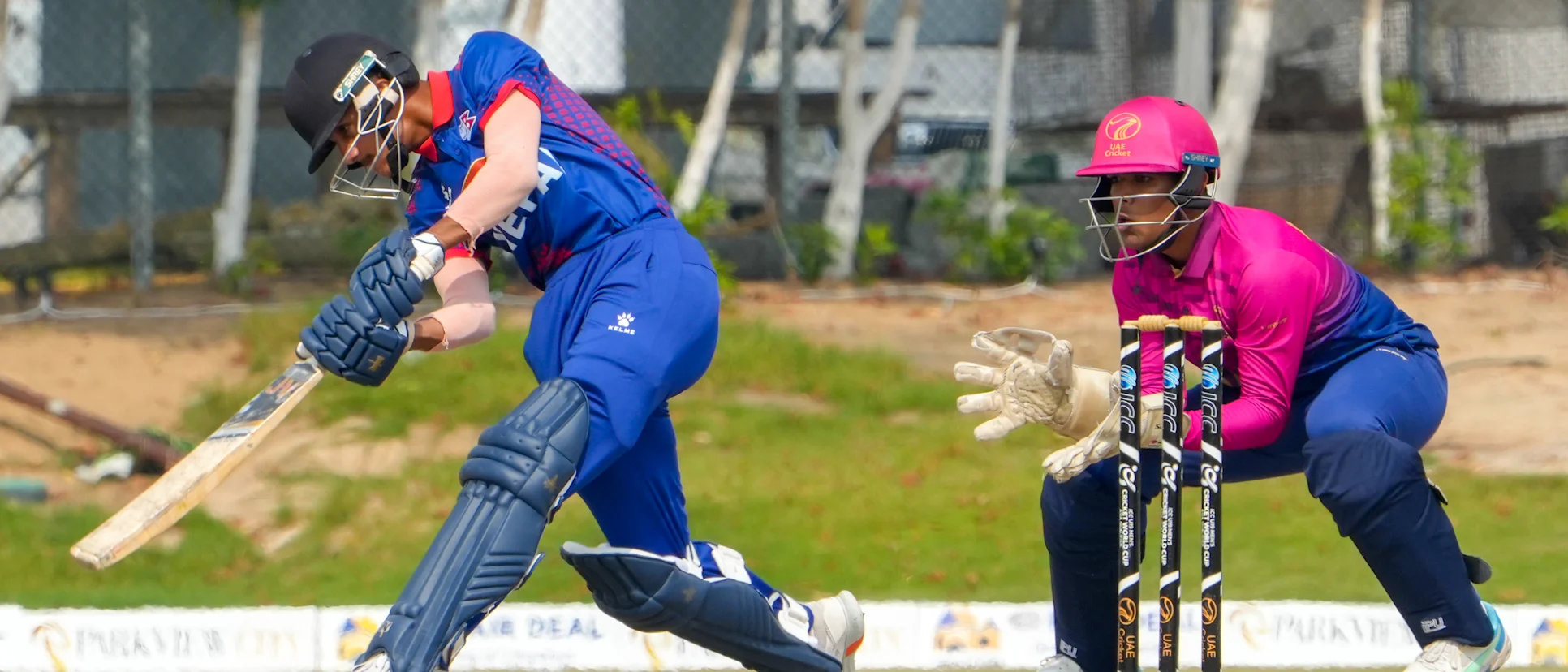 Logo of Nepal and UAE in action in the ICC U19 Men's CWC Asia Division 1 Qualifier 2023