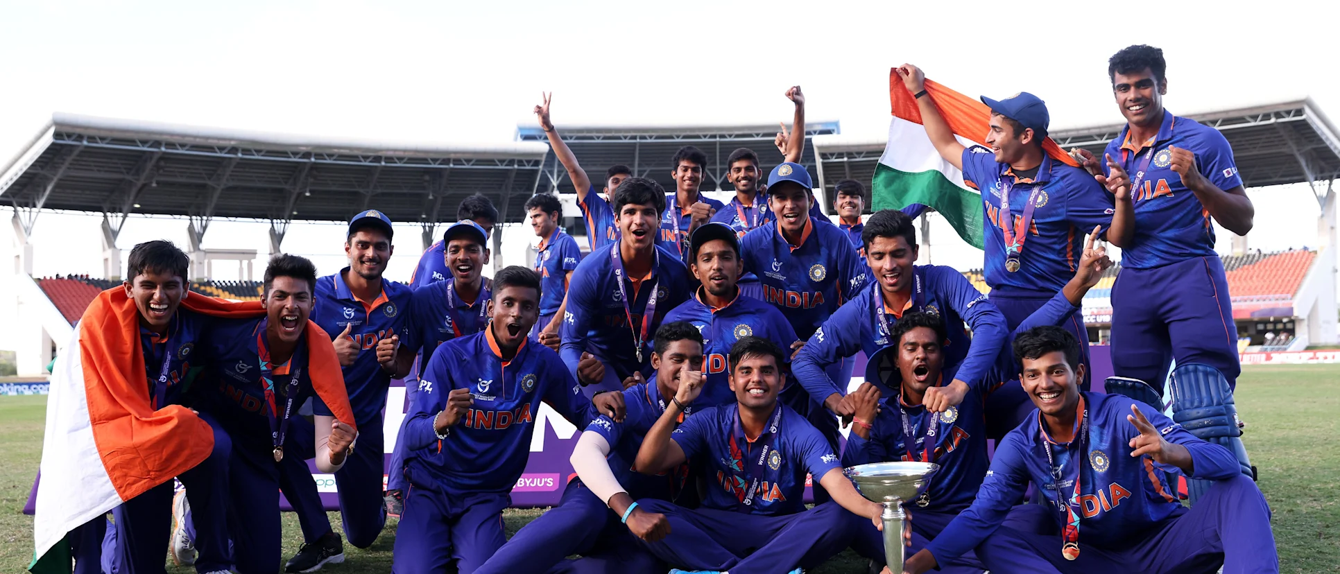 Logo of India pose with U19 CWC trophy