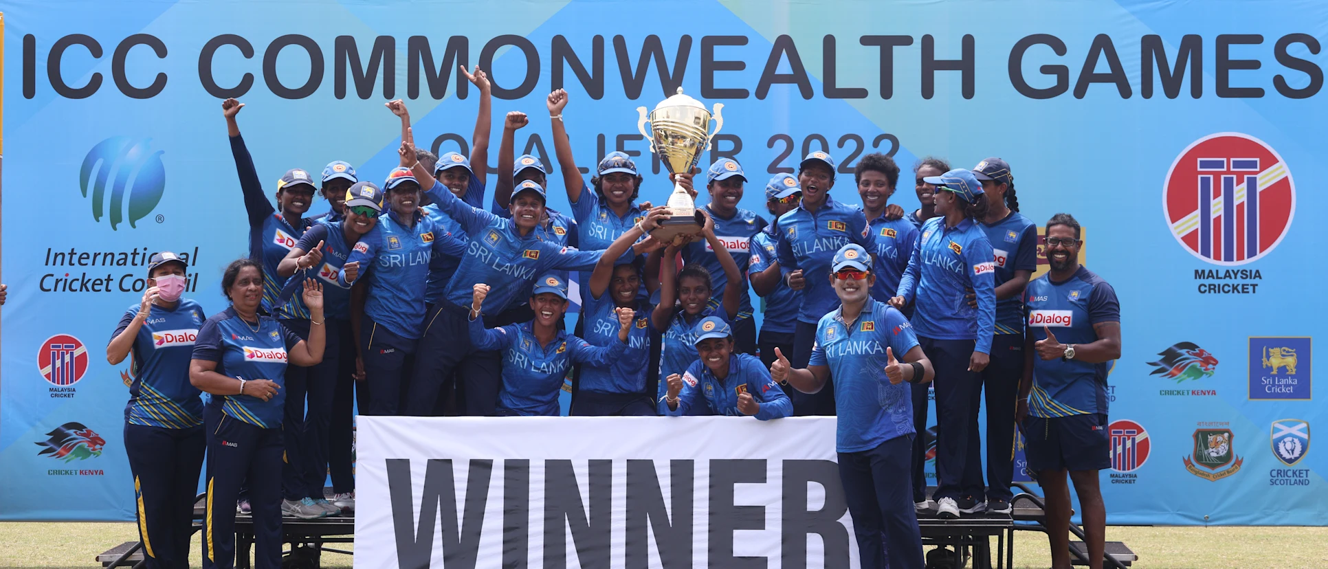 Logo of The victorious Sri Lankan team poses with the trophy after winning all four games in the CWG22 Qualifier.