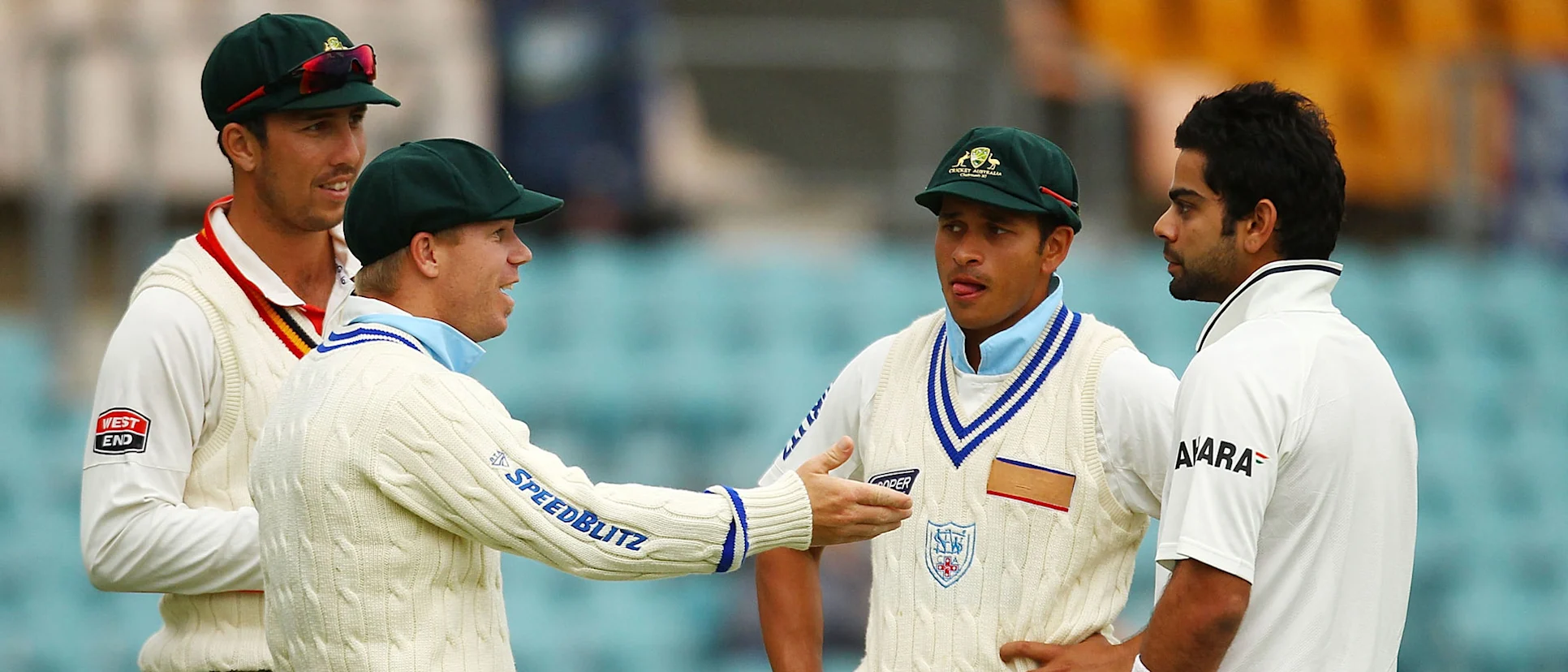 Logo of Warner and Khawaja chat with Virat Kohli during a tour game in Canberra in 2011 // Getty Images