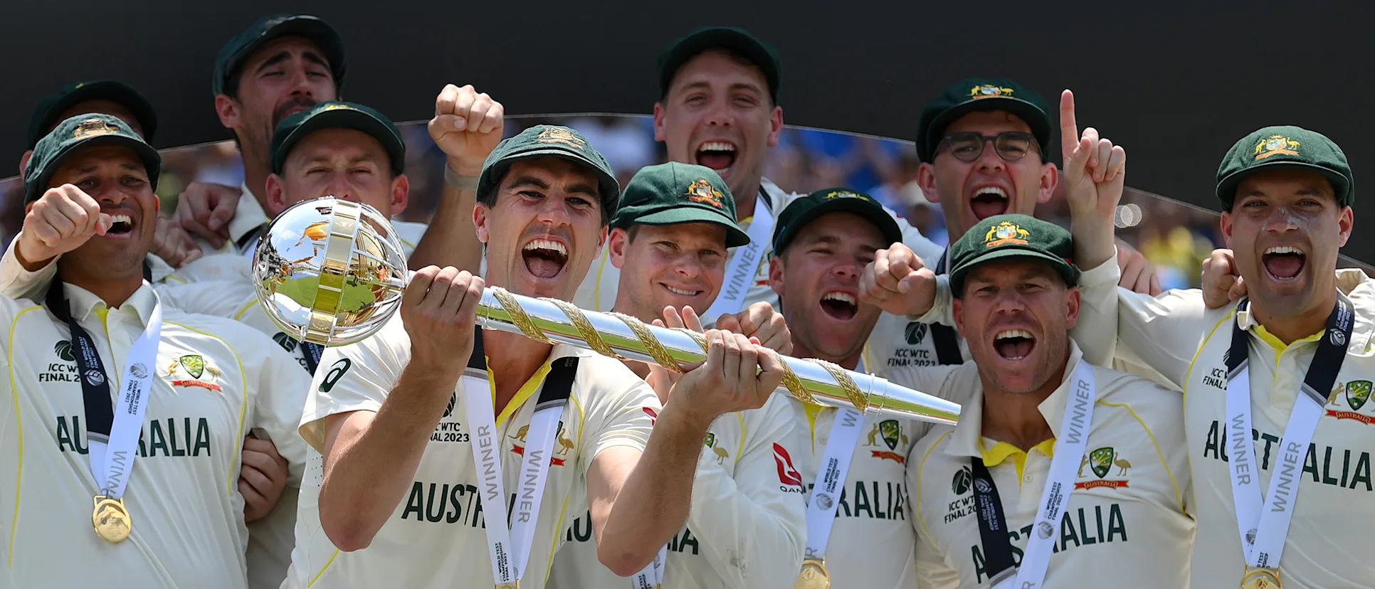Logo of Pat Cummins of Australia lifts the ICC World Test Championship Mace on day five of the ICC World Test Championship Final between Australia and India