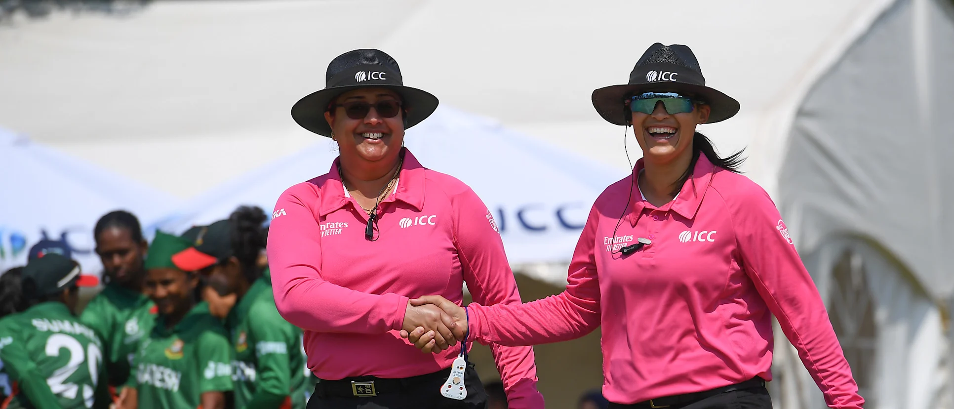 Match Umpires Kerrin Klaaste and Jasmine Naeem look on during the ICC Women's U19 T20 World Cup 2023 match between Bangladesh and USA at Willowmoore Park B Field on January 18, 2023 in Benoni, South Africa.