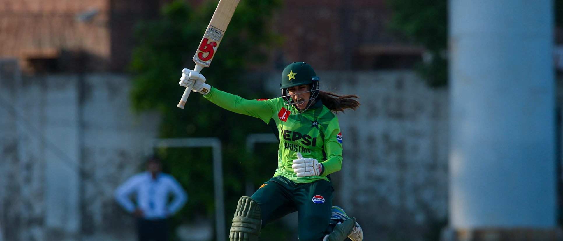 Logo of Aliya Riaz celebrates after hitting the winning runs at LCCA Ground