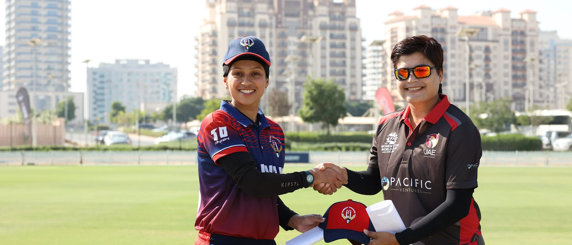 Logo of Kuwait captain Amna Tariq with UAE captain Chaya Mughal