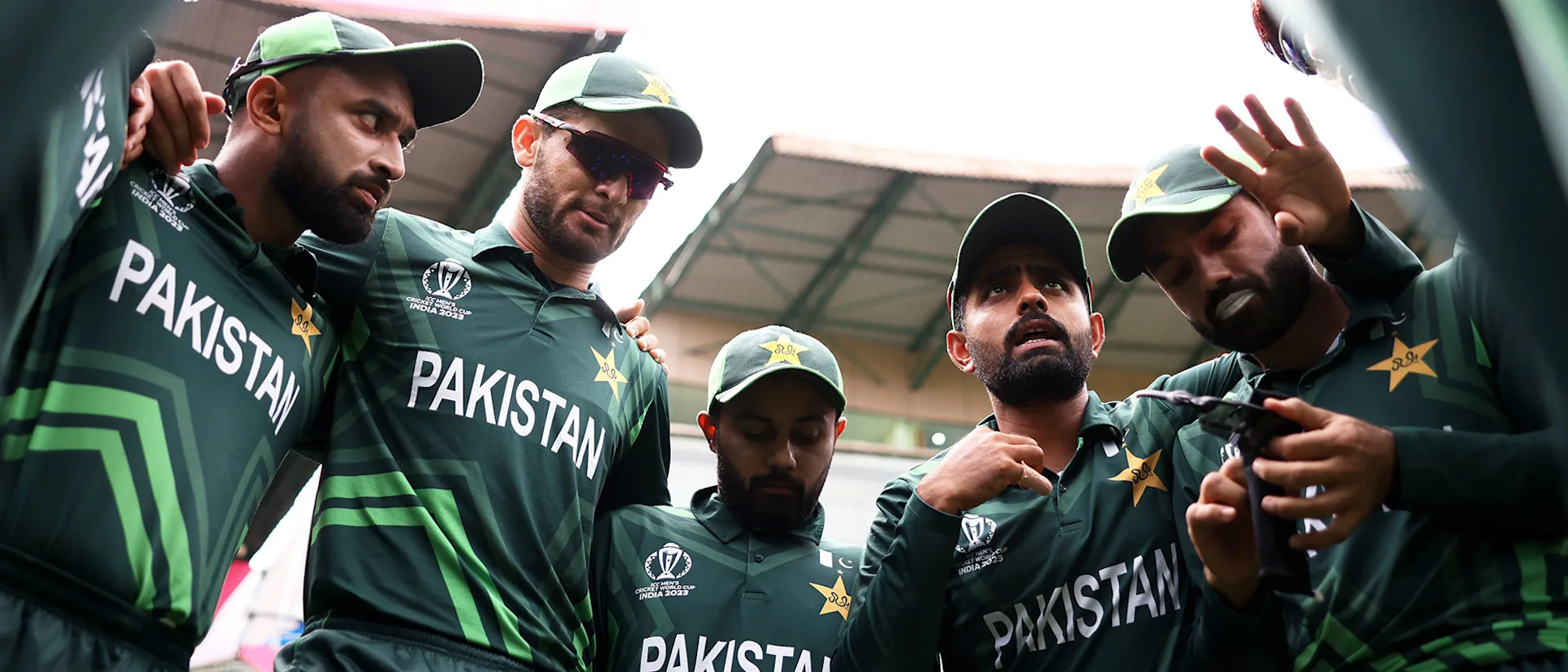 Logo of Babar Azam of Pakistan speaks to their side in the huddle ahead of the ICC Men's Cricket World Cup India 2023 between New Zealand and Pakistan