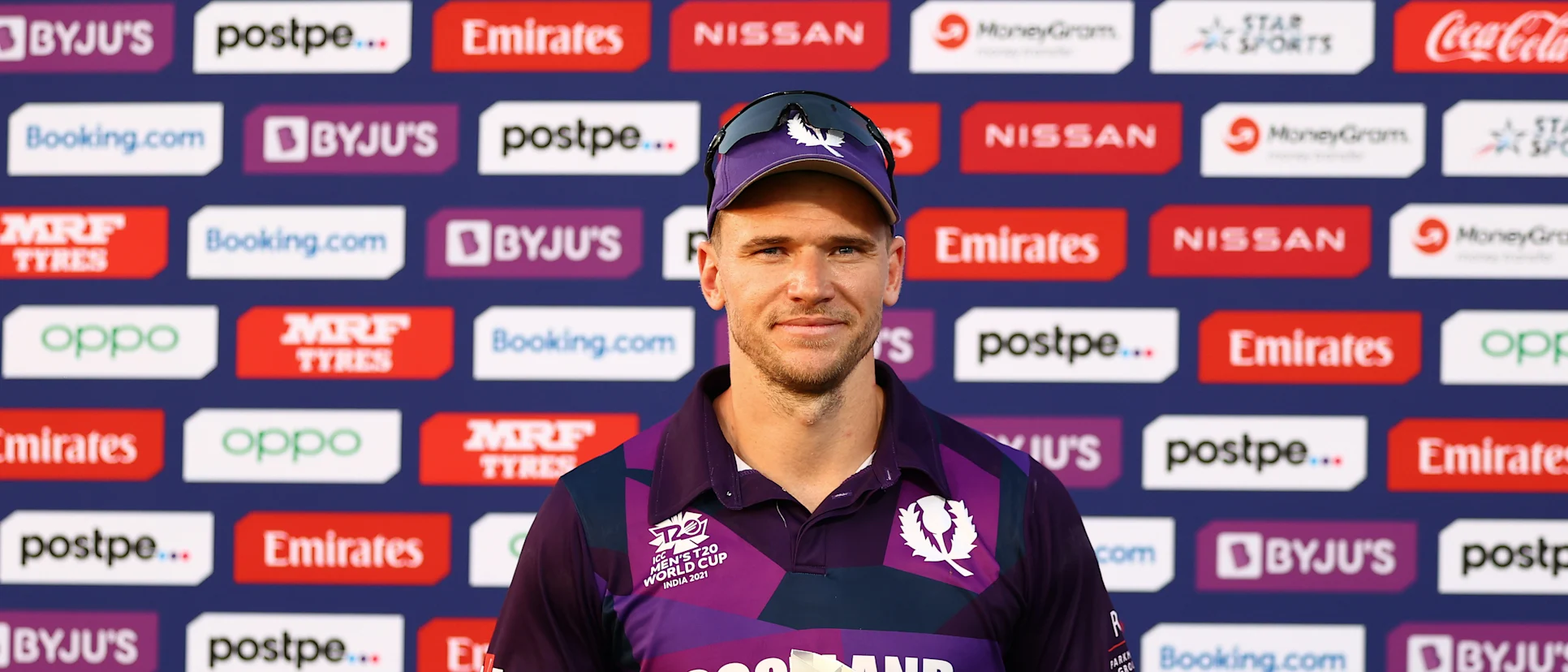 Logo of Richard Berrington of Scotland poses after being named Player of the Match the ICC Men's T20 World Cup match between Scotland and Papua New Guinea at Oman Cricket Academy Ground on October 19, 2021 in Muscat, Oman.
