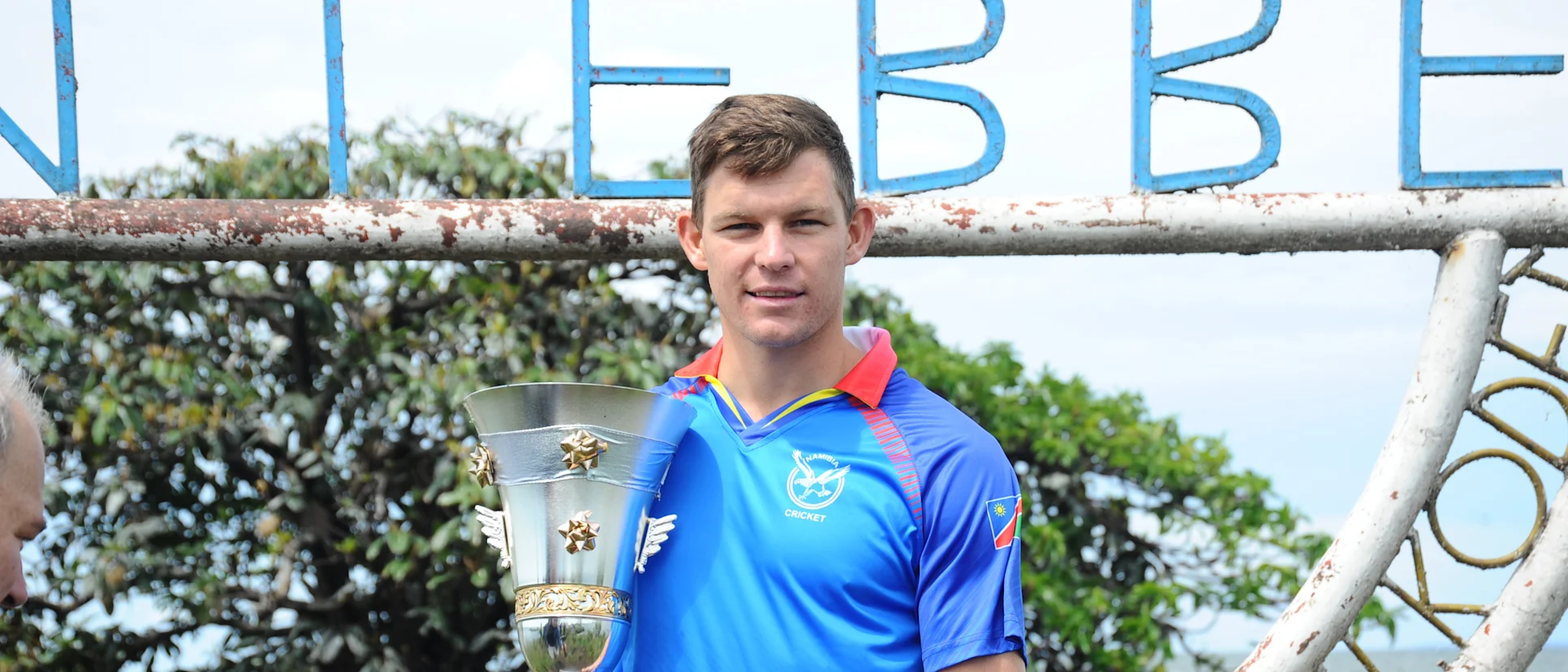 Logo of Namibia captain Gerhard Erasmus with the ICC T20 World Cup Africa Final Qualifier trophy