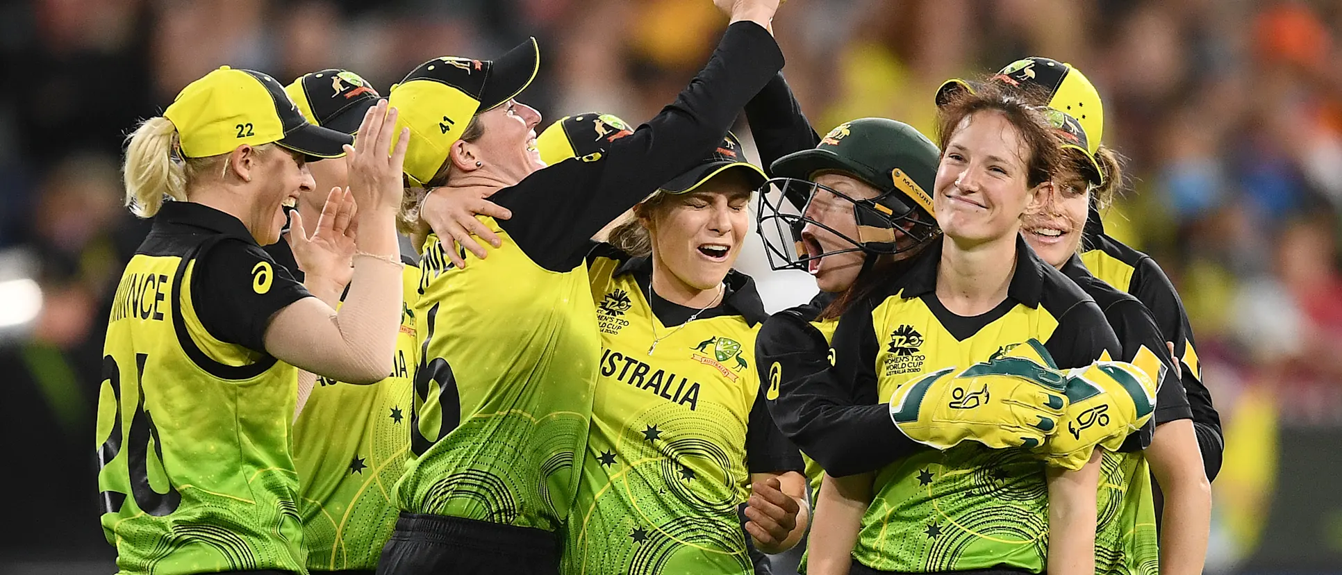 Megan Schutt of Australia is congratulated by team mates after getting a wicket during the ICC Women's T20 Cricket World Cup Final match between India and Australia at the Melbourne Cricket Ground on March 08, 2020 in Melbourne, Australia.