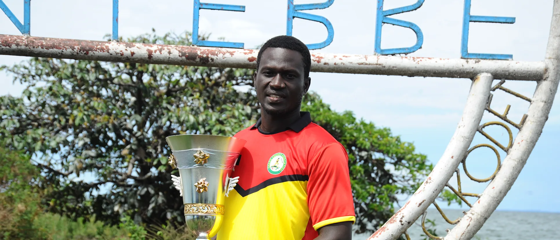 Logo of Ghana captain Isaac Aboagye with the ICC T20 World Cup Africa Final Qualifier trophy