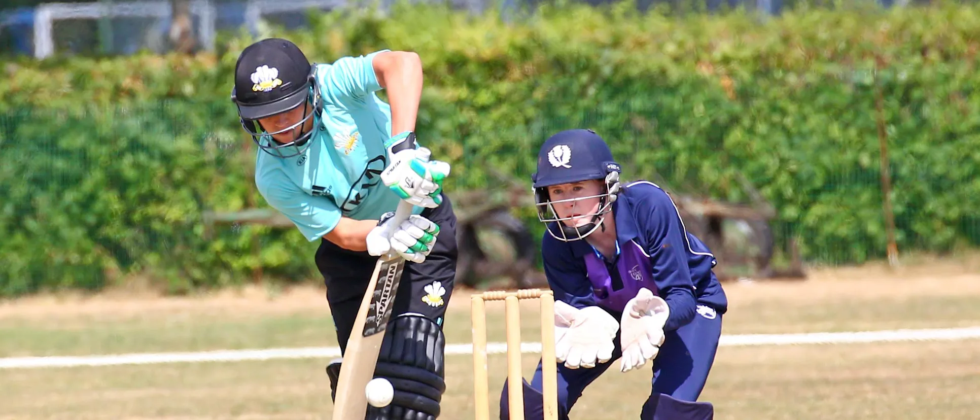 Logo of Sarah Bryce watches on as Marizanne Kapp hits to the leg-side